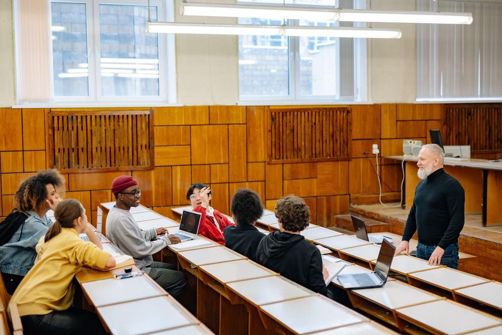 Students seated in a tiered lecture room